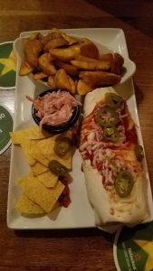 Burrito, spicy coleslaw, fries and chips.