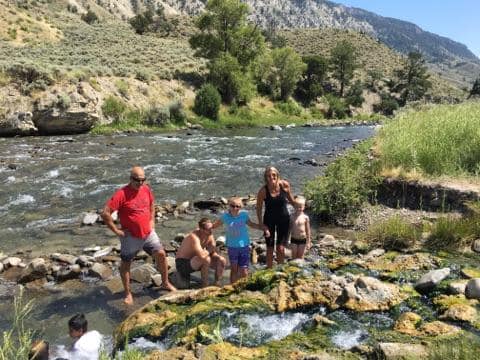 My family standing ithe warm water at Boiling River - Gardiner River