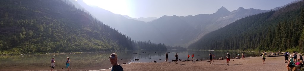 A group of people around Avalanche Lake in Glacier Park