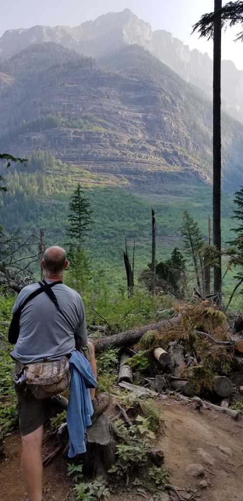 Man standing in front of a mountain