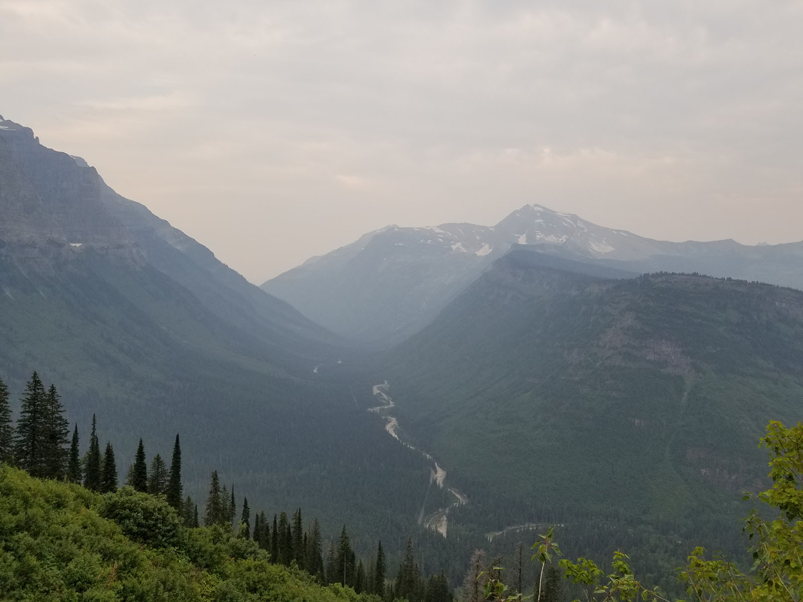 The view of a river with mountains in the background