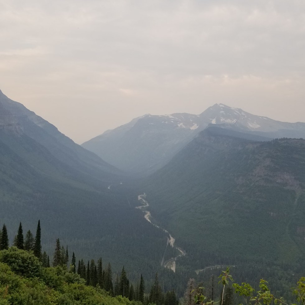 The view of a river with mountains in the background