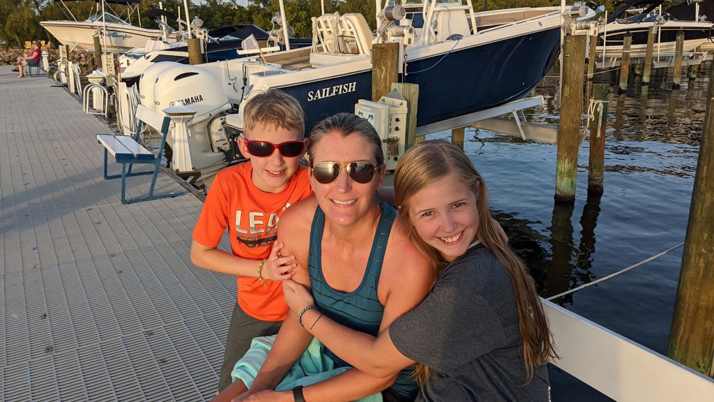 Jill gets a hug on the dock