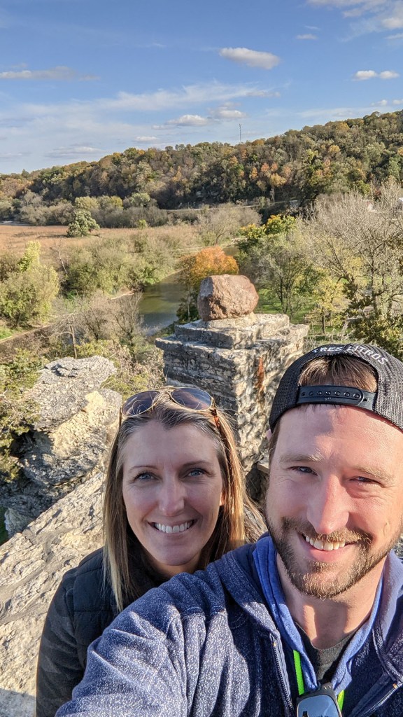 A couple at the top of a bluff