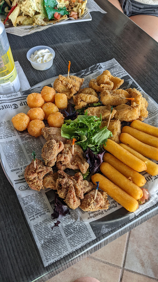 Fried fish, chicken, cheese balls, and corn sticks