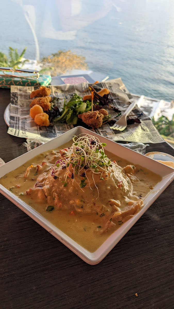 Seafood mofongo with the ocean in the background
