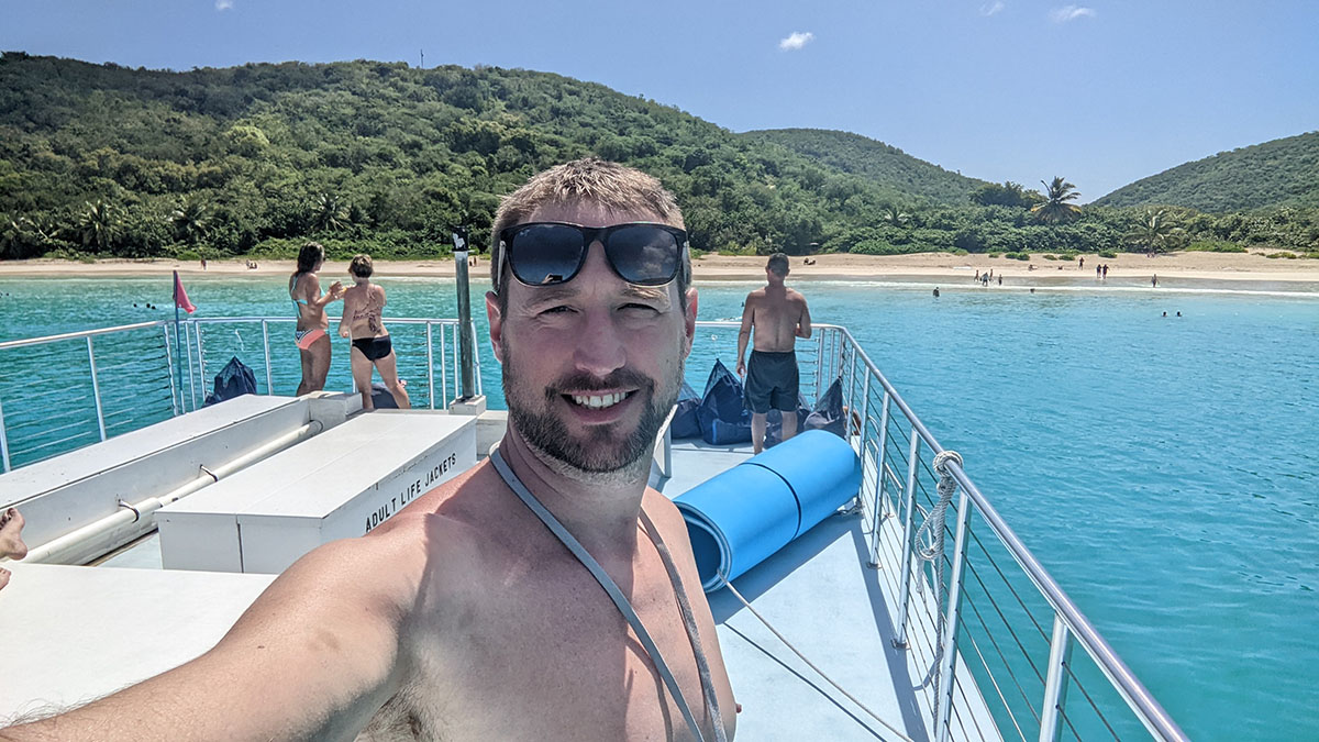 People on the roof of a catamaran at Flamenco Beach