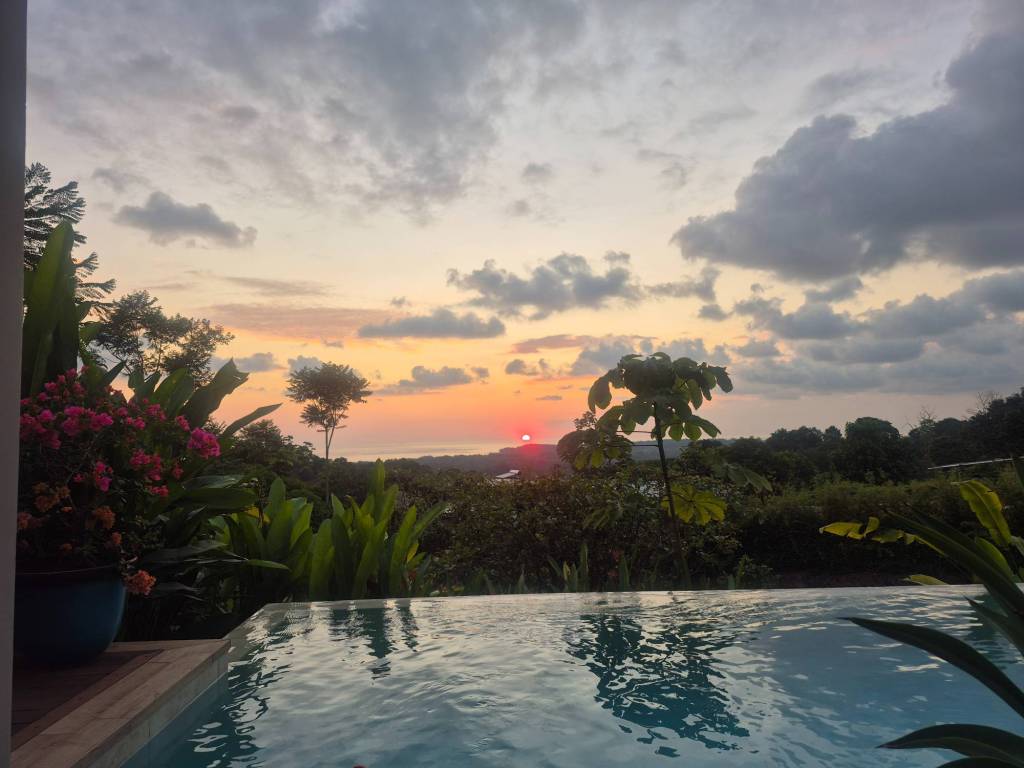 Sunsetting by pool, sun visible