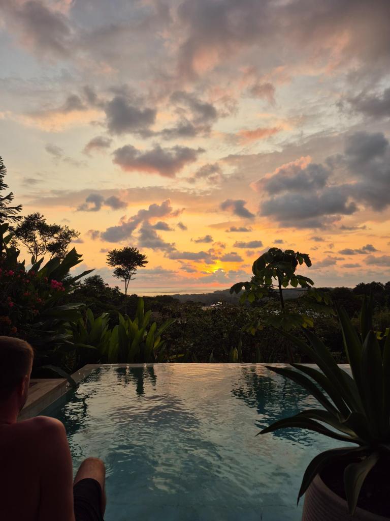 Sunset with our feet in the pool