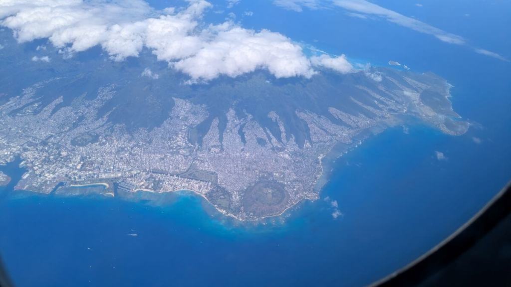 The island of Oahu from our plane. Diamond head is visible.