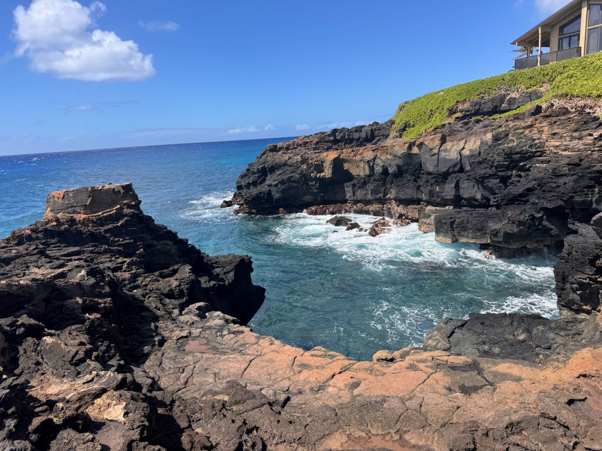 A cover amongst black lava rock.
